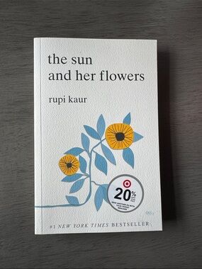 The Sun and Her Flowers Rupi Kaur — White Cover with Yellow & Blue Floral Design